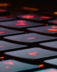 Image of notebook keys with letters glowing red